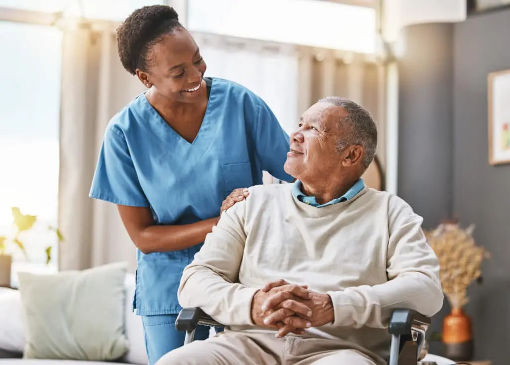 Nurse with an older man in a wheelchair
