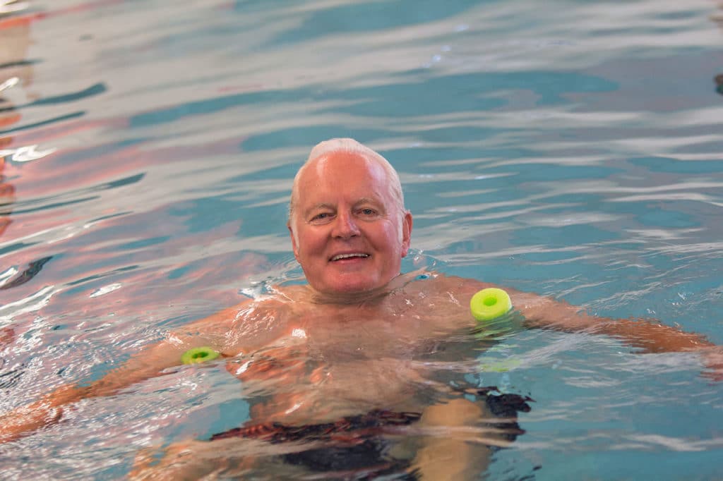 senior man swimming at Live Well Fitness at Rehab Westminster Village West Lafayette