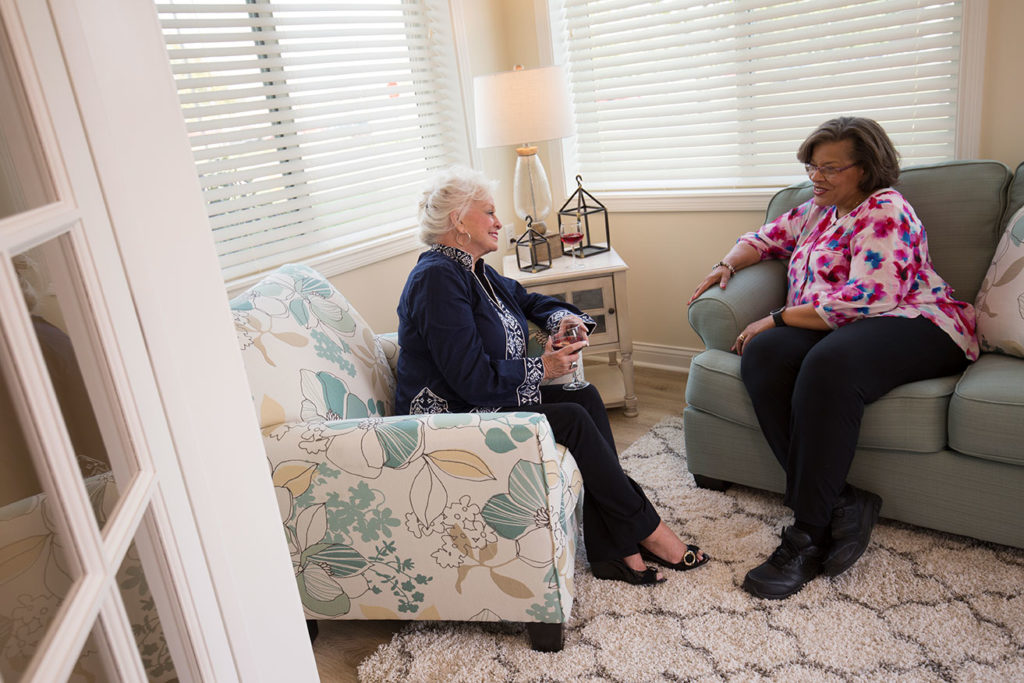 senior women talking in sunroom at Westminster Village West Lafayette