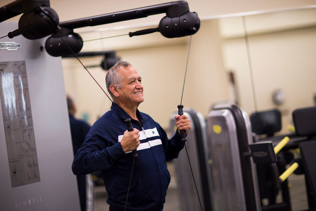 Senior using weight machince at Live Well Fitness and Rehab at Westminster Village West Lafayette