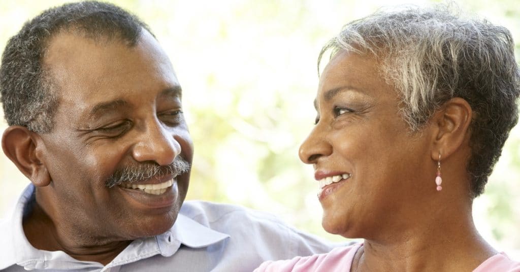 Senior parents happily sitting together