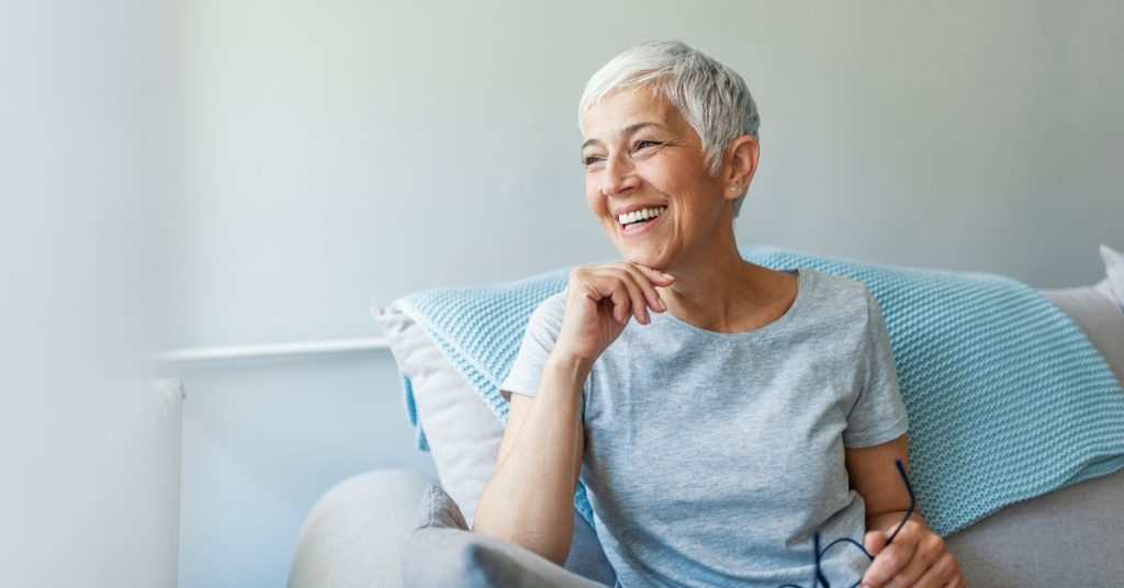 senior lady happily living in a life plan community