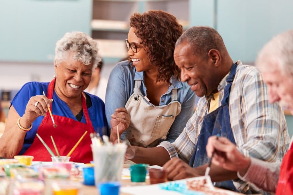 Older adults enjoying art activity at senior living community