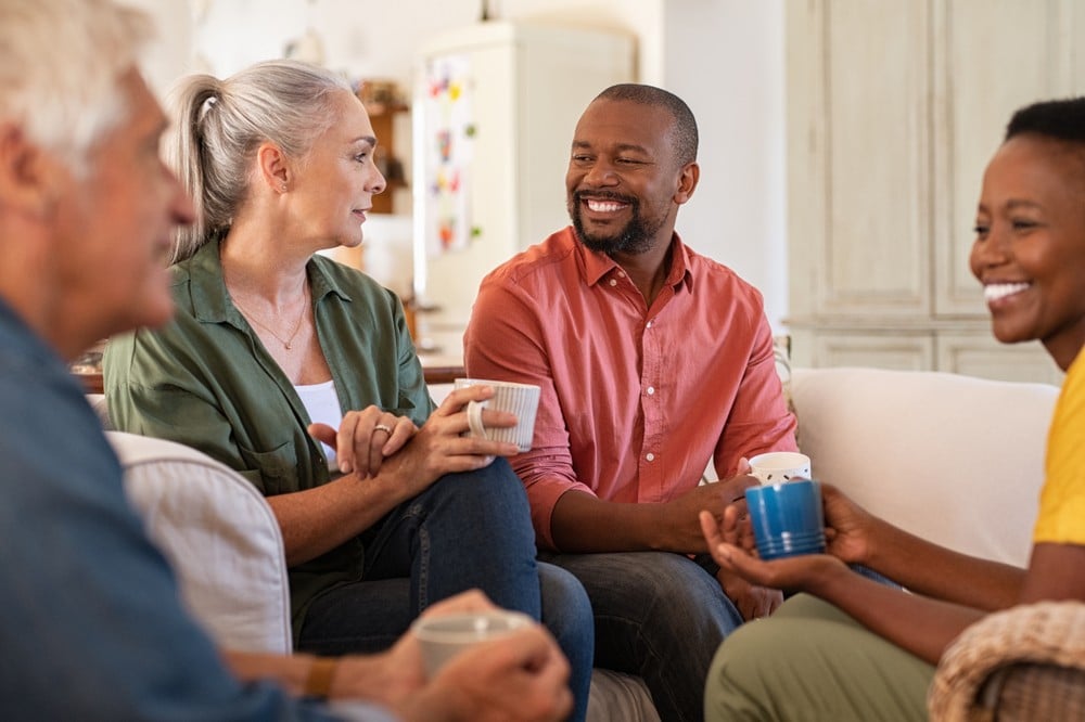 Senior friends socializing with coffee