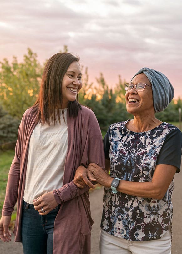 adult daughter and mom taking a walk