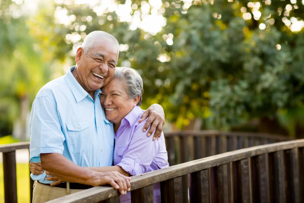 Elder Couple Hugging & Smiling Images