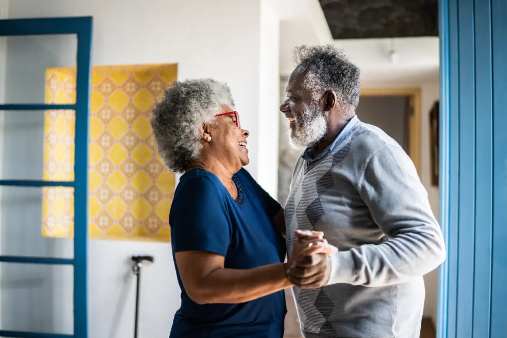 elderly couple dancing smiling